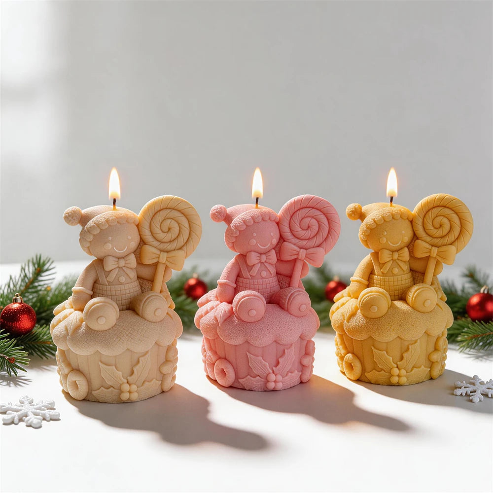 Gingerbread lollipop Christmas candles in cream, pink and golden wax
