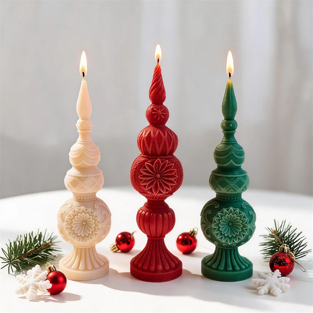 Red, green and cream Christmas finial candles displayed with festive ornaments