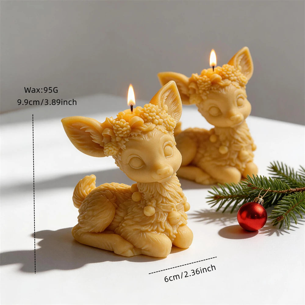 Floral reindeer candle measuring 9.9 centimetres tall