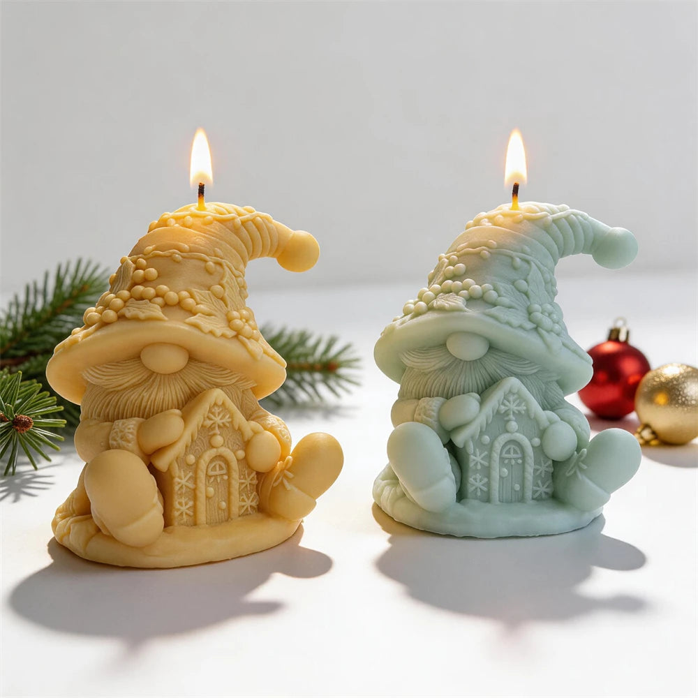 Christmas gnome candles holding a miniature gingerbread house