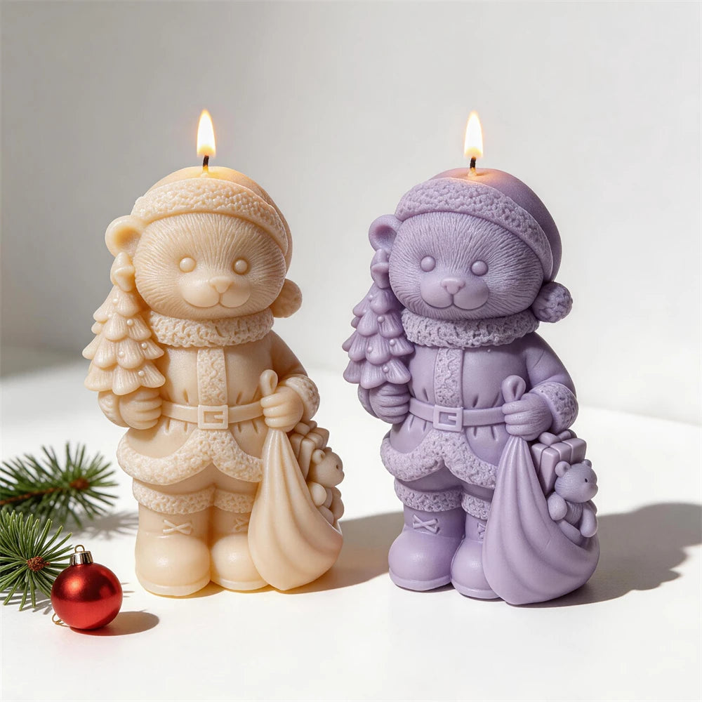 Christmas bear candles carrying a small tree and gift sack