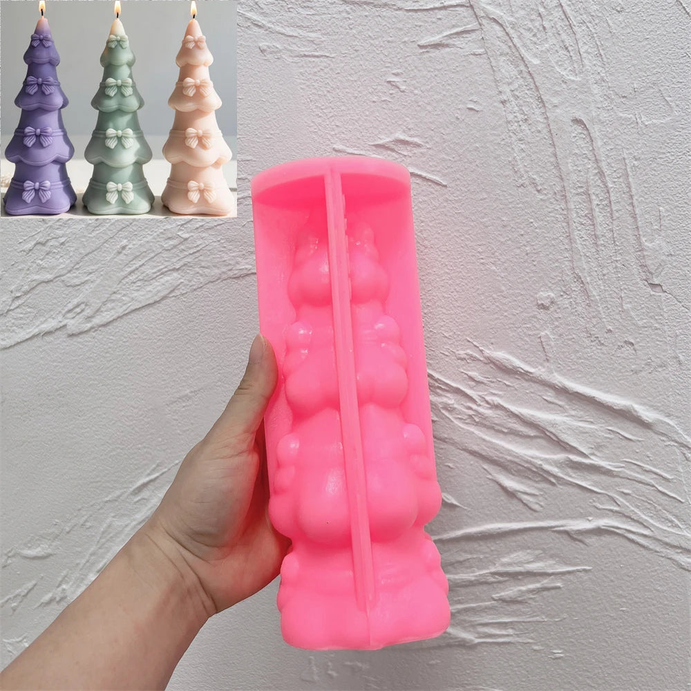 Pink silicone mold for creating a ribbon bow Christmas tree candle