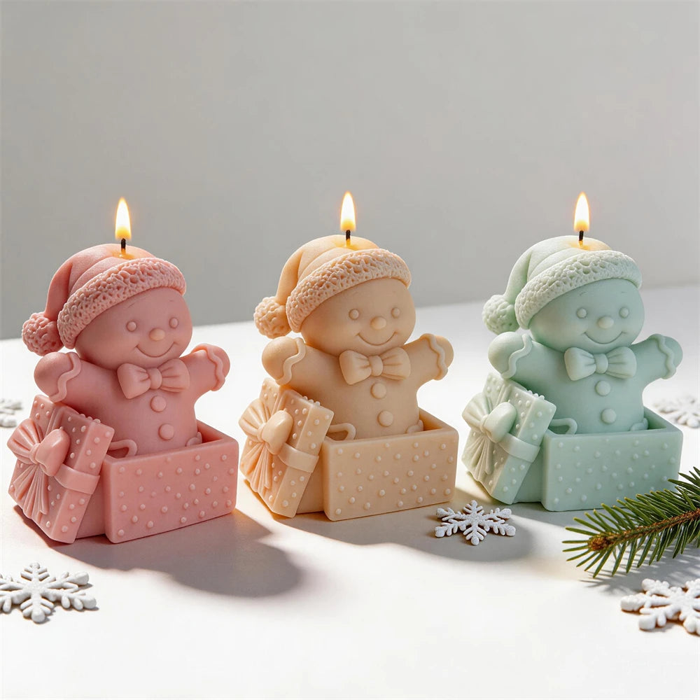 Gingerbread man gift box candles in pink, cream and mint green