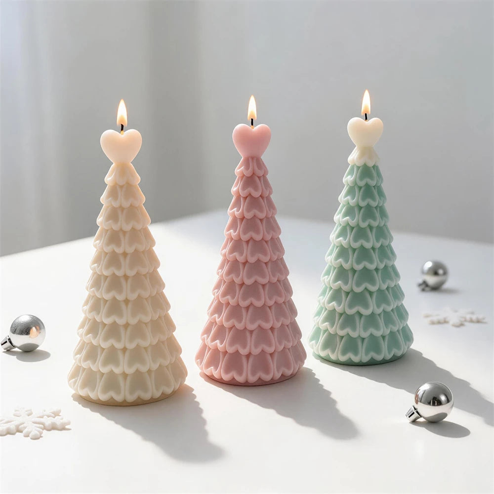 Pastel heart-topped Christmas tree candles displayed with festive ornaments