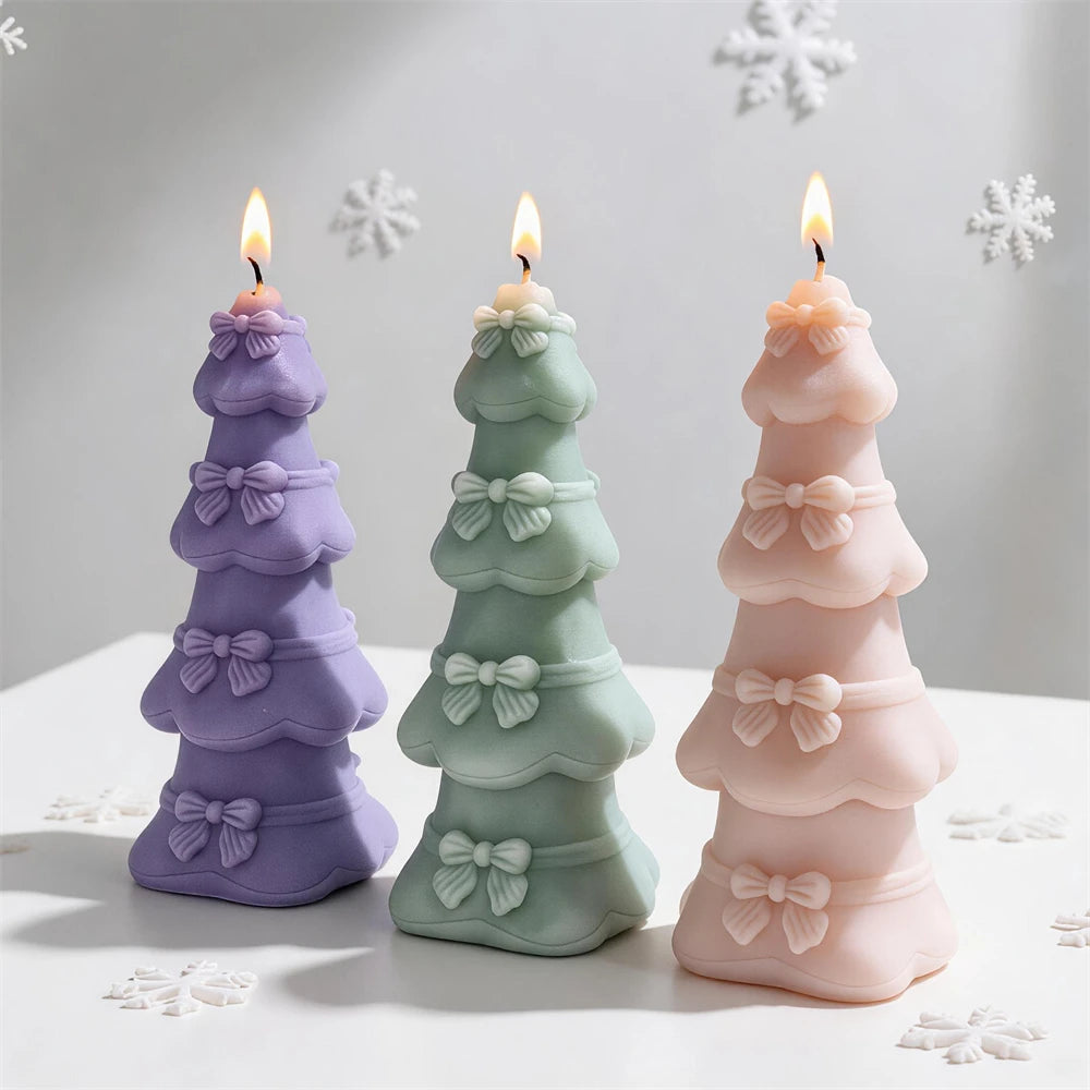 Tiered bow Christmas tree candles in pastel purple, green and pink