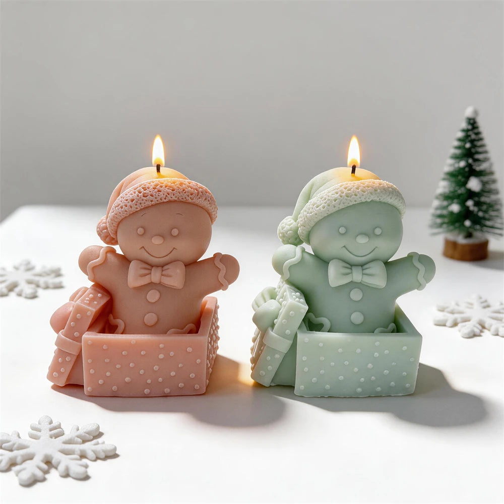 Festive gingerbread character candles with Santa hats and gift bows