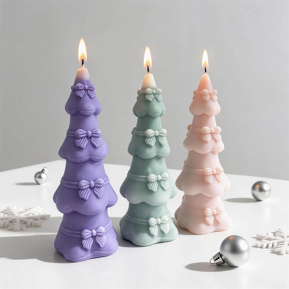 Tiered bow Christmas tree candles in pastel purple, green and pink
