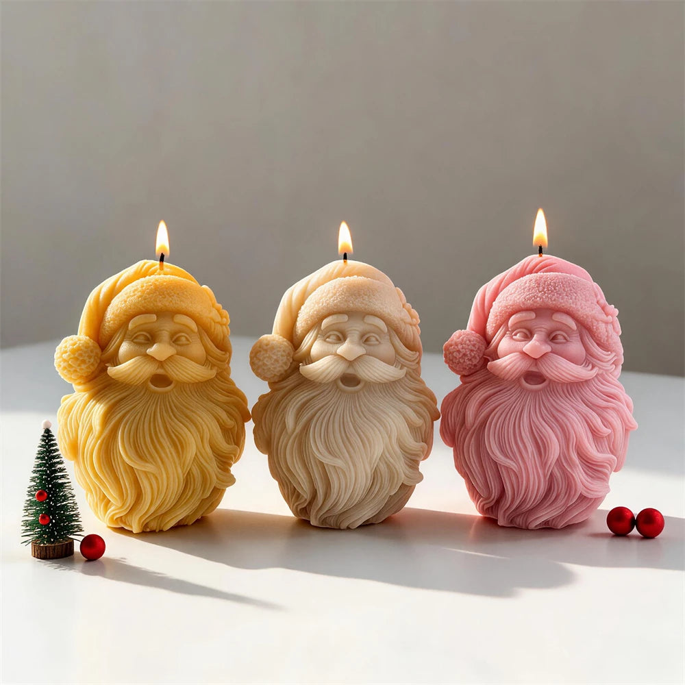 Bearded Santa face candles in cream, yellow and pink wax