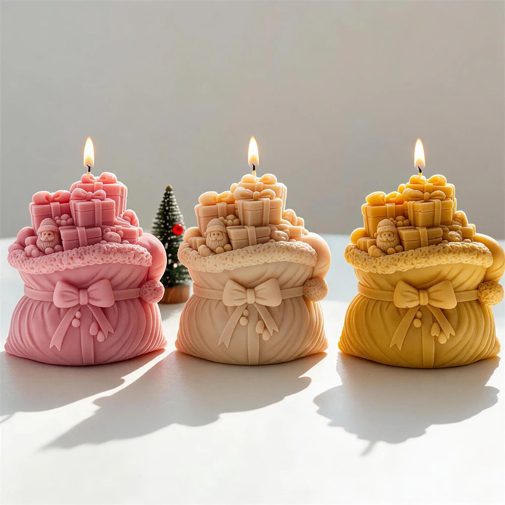 Festive gift sack candles in cream, pink and gold wax