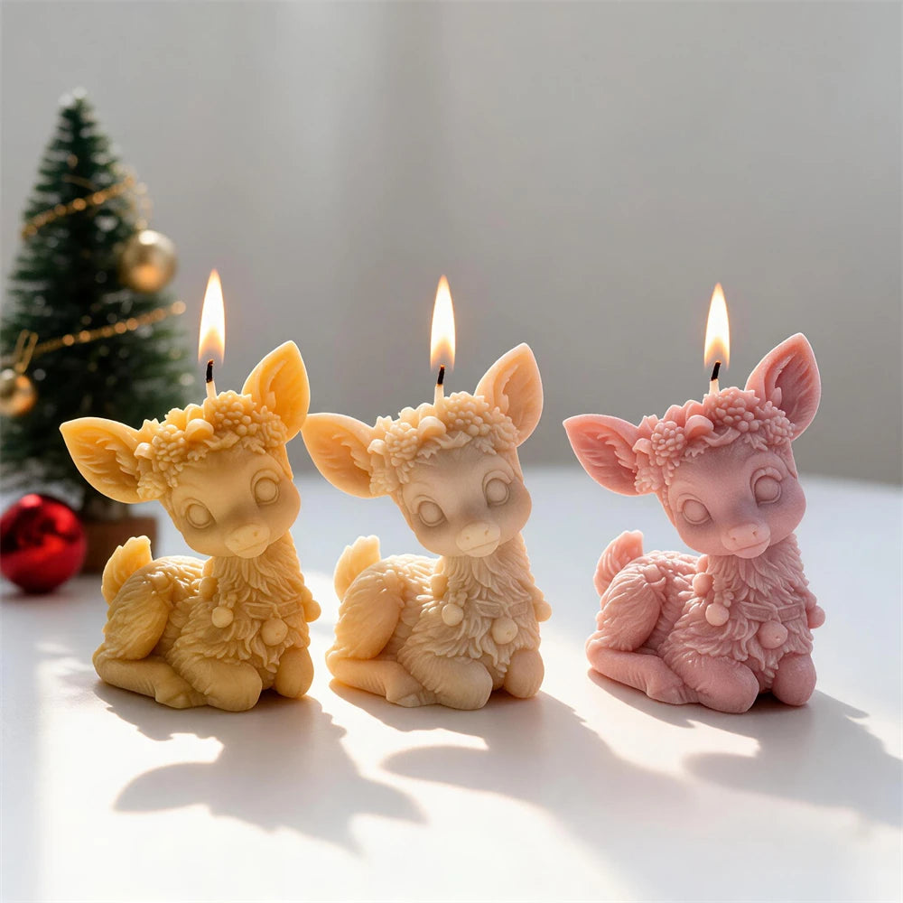 Floral crown sitting reindeer candles in cream, pink and golden wax