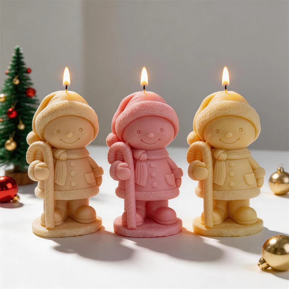 Christmas child candle wearing a pom-pom hat and holding a candy cane