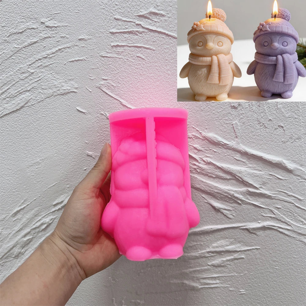 Pink silicone mold for creating a winter penguin candle