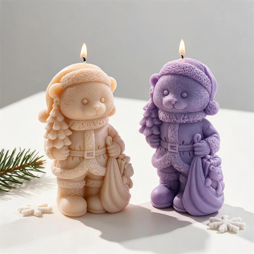 Teddy bear candle wearing a knitted hat, scarf and winter coat