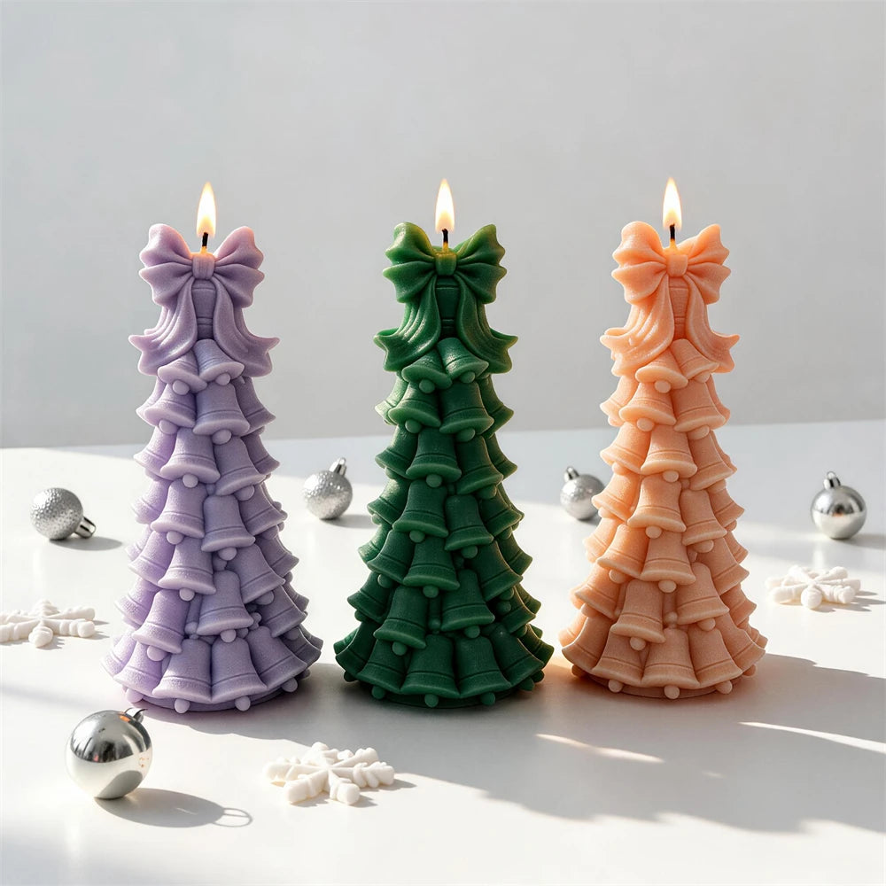 Christmas tree candle made from layered bells and small ornament details