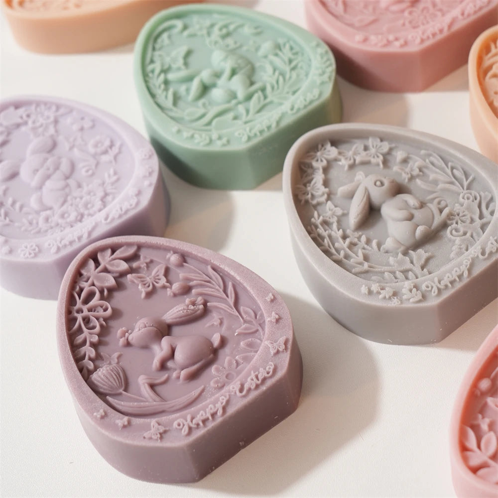 Decorative soap bars with intricate designs on a light background