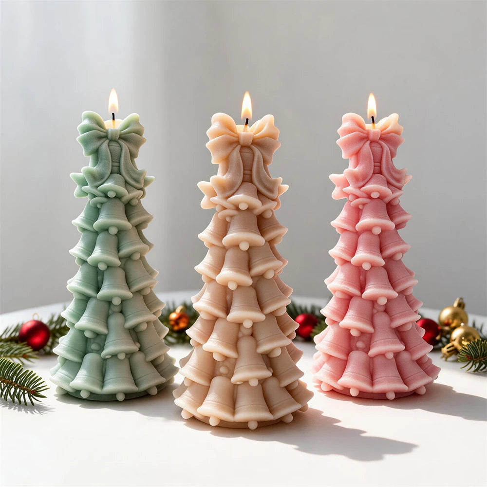 Stacked bell Christmas tree candles with large ribbon bow toppers