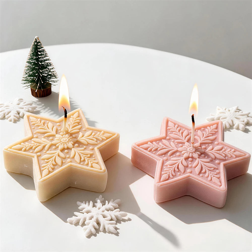 Ornate snowflake star candles with detailed six-point winter patterns