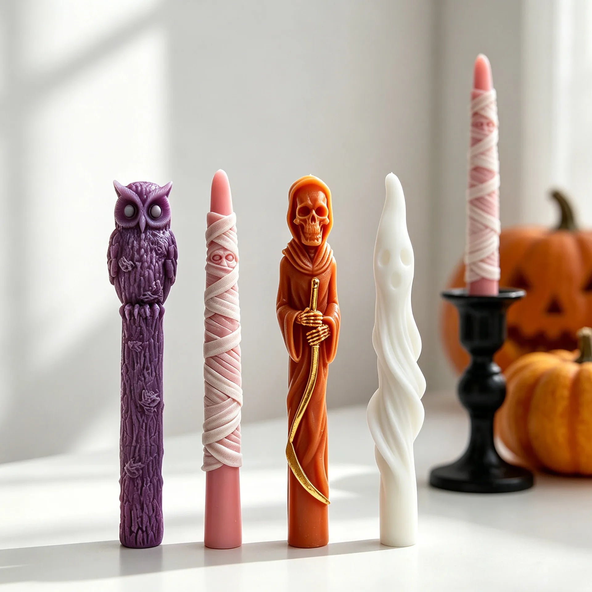 Halloween taper candles in mummy ghost Grim Reaper and owl designs