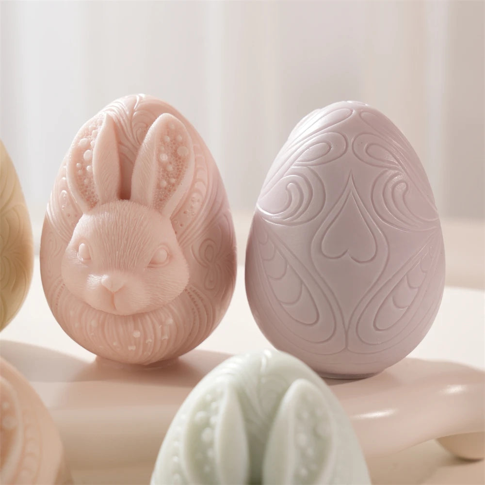 Decorative Easter eggs with rabbit and floral patterns on a light background