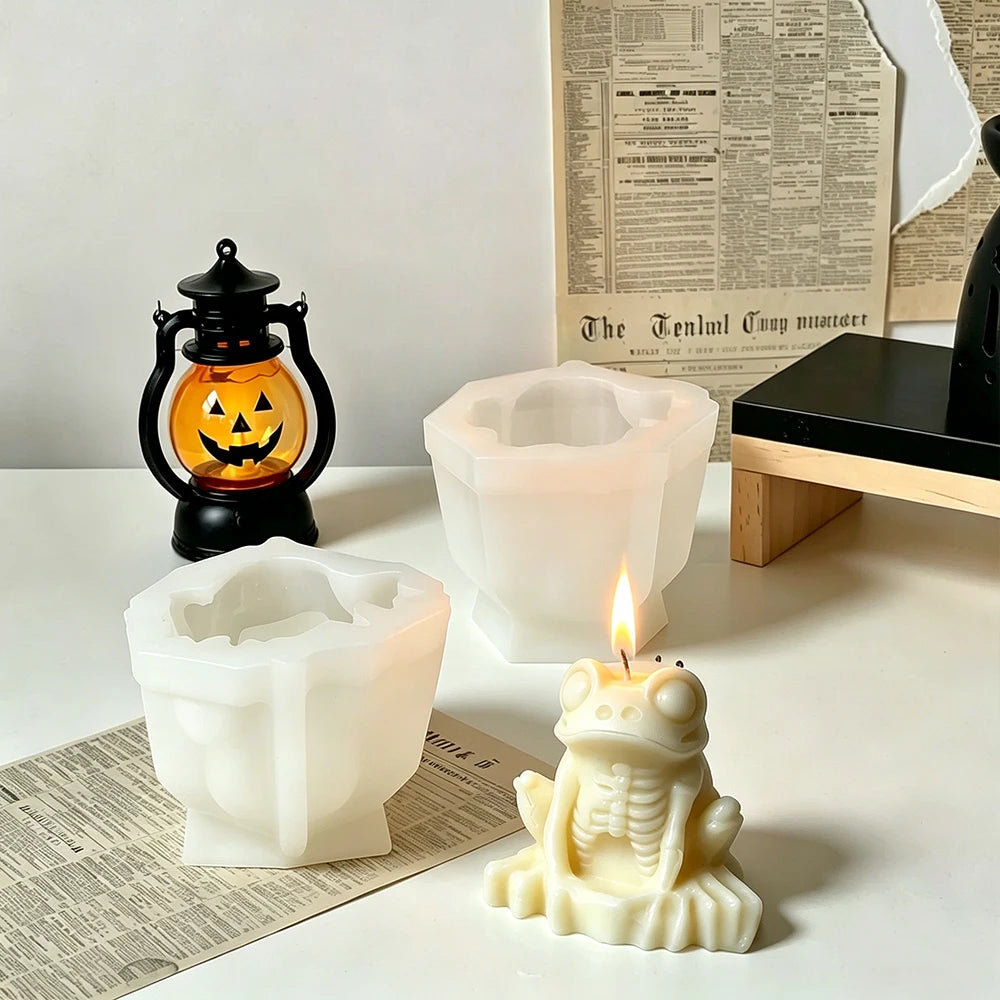 Skeleton frog Halloween candle with exposed ribs and webbed feet