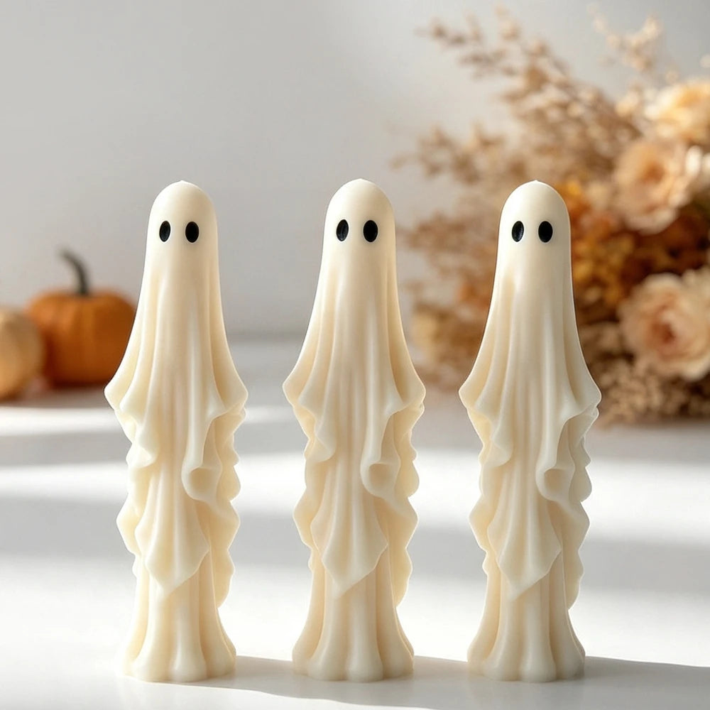 Classic Halloween ghost candle with oval eyes and draped body