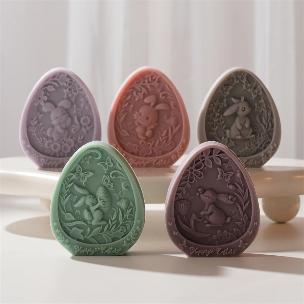 Five decorative Easter eggs with embossed designs on a white surface.