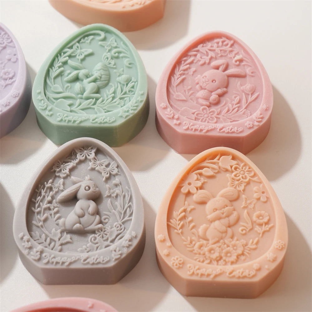 Decorative soap bars with rabbit designs on a light background