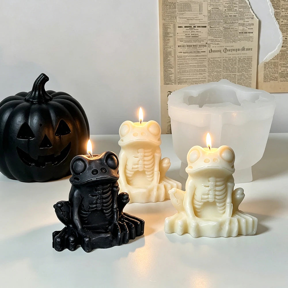 Gothic frog candle with large eyes skeletal torso and long fingers