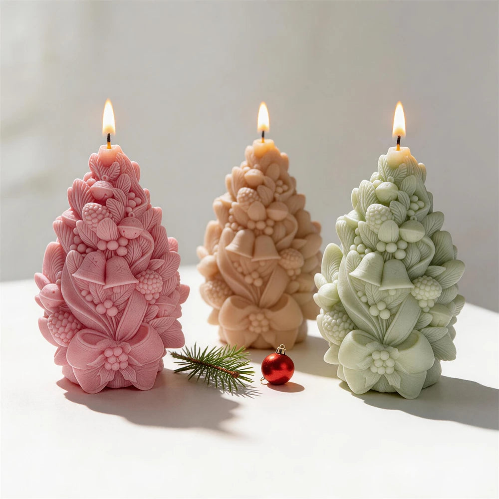 Pinecone bell Christmas tree candles with botanical foliage and ribbon bows