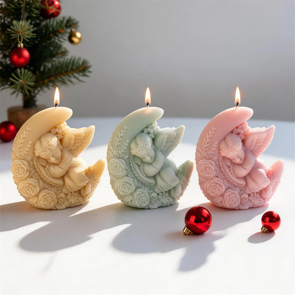 Winged angel resting inside a floral crescent moon candle design