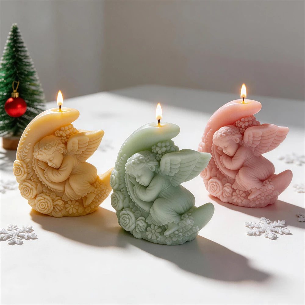 Winged angel resting inside a floral crescent moon candle design