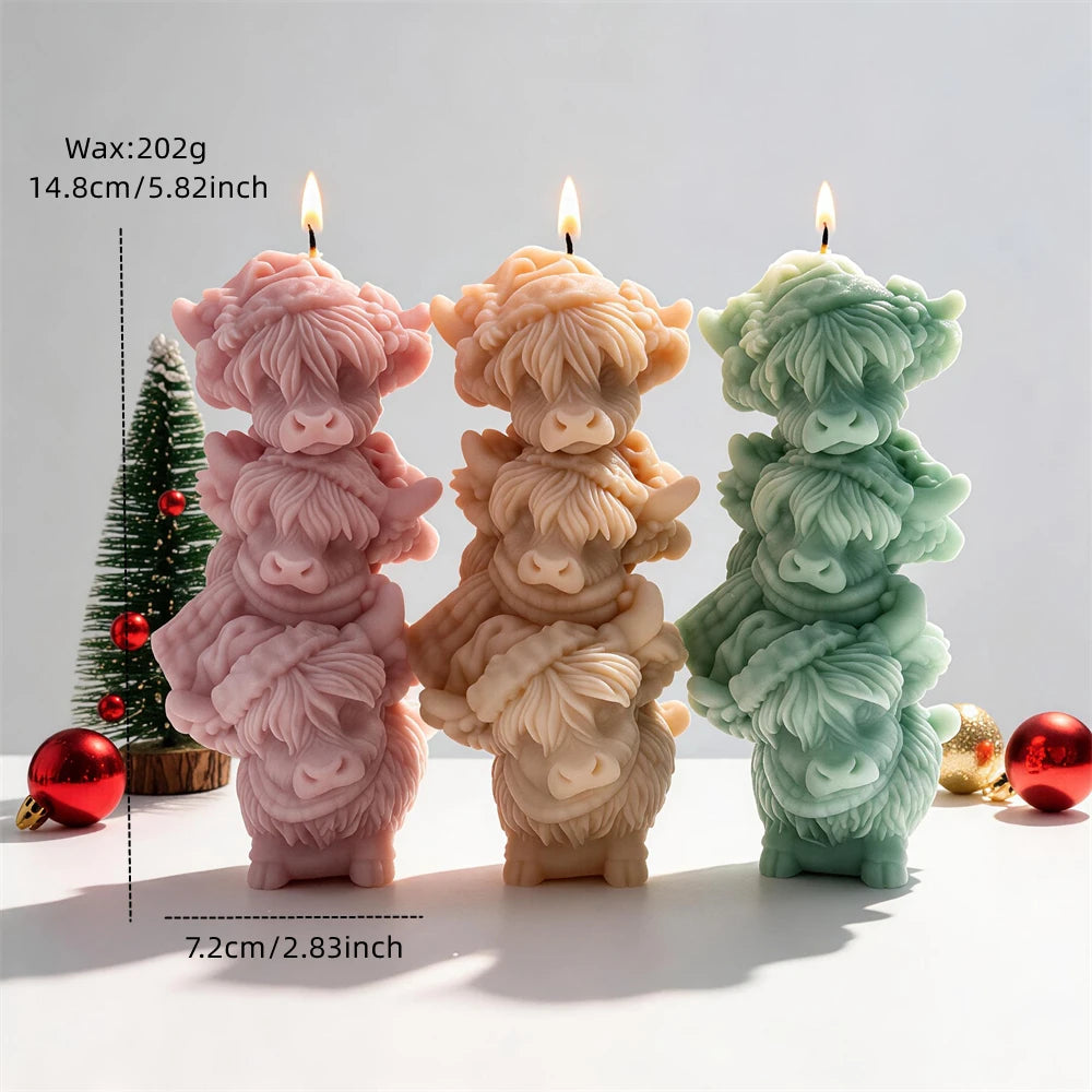Highland cow trio candle measuring 14.8 centimetres tall