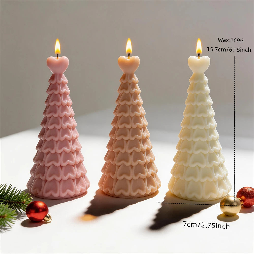Pastel heart-topped Christmas tree candles displayed with festive ornaments