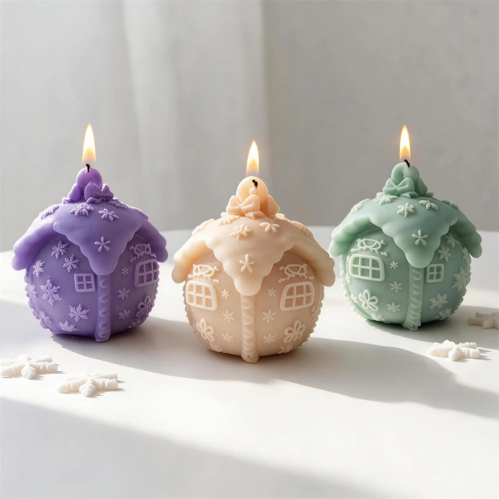 Snowy cottage Christmas ball candles in purple, cream and pastel green