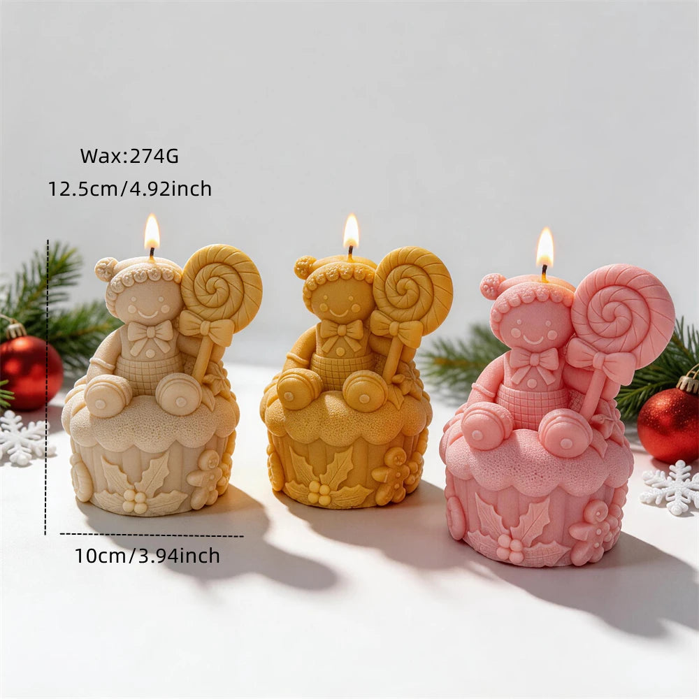 Christmas gingerbread candle sitting on a decorated cake base