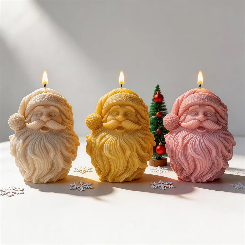 Bearded Santa face candles in cream, yellow and pink wax