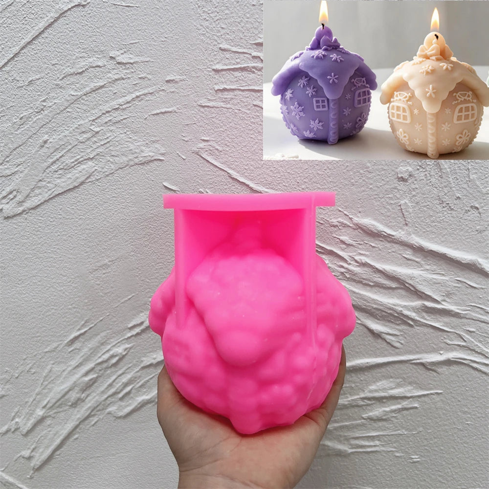 Pink silicone mold for creating a Christmas cottage ball candle
