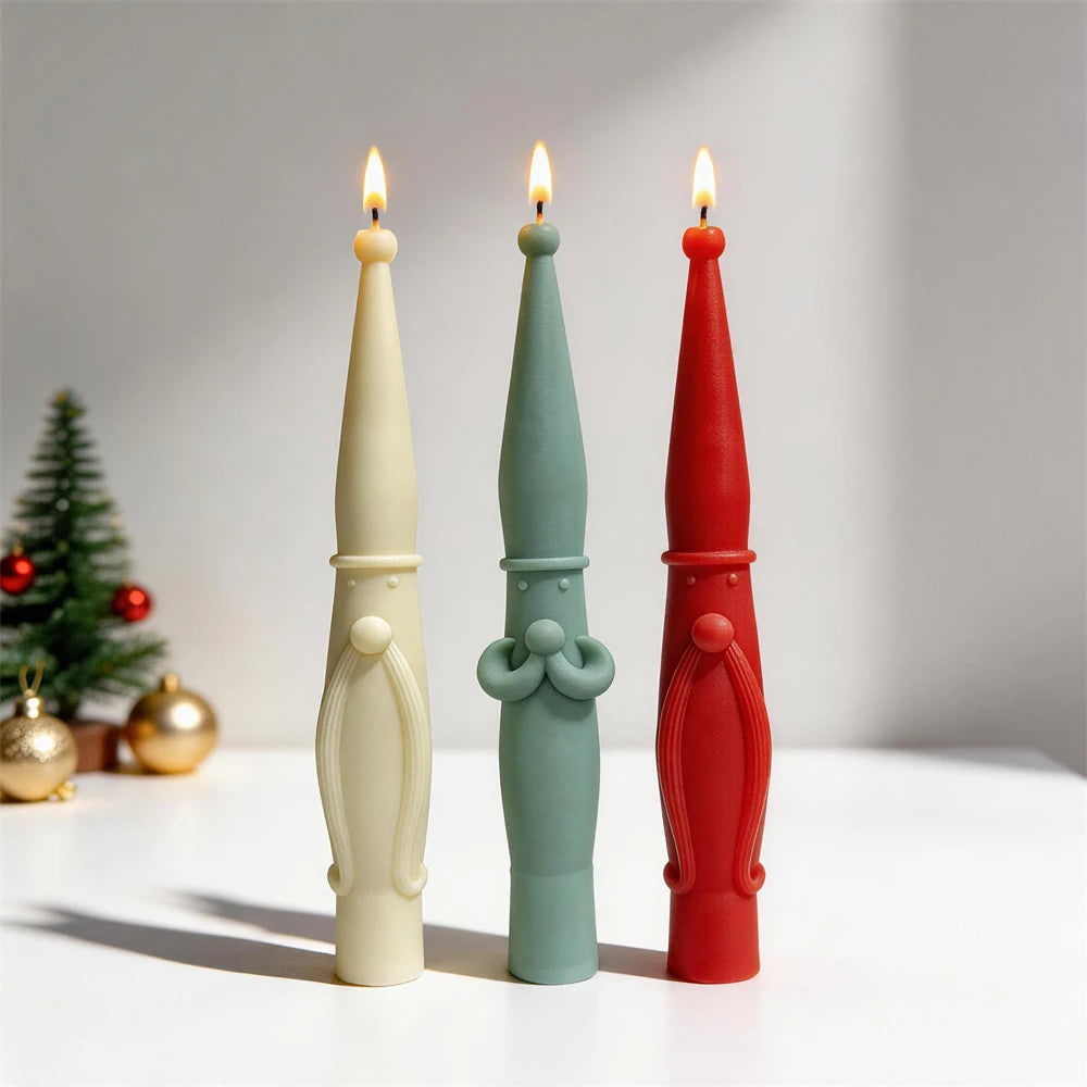 Tall Scandinavian Santa pillar candles in cream, red and green