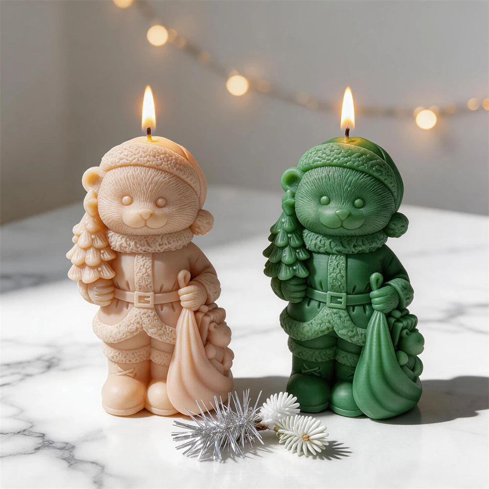 Christmas bear candles carrying a small tree and gift sack