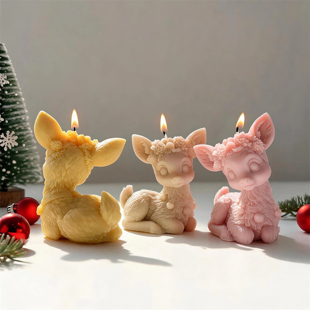 Floral crown sitting reindeer candles in cream, pink and golden wax