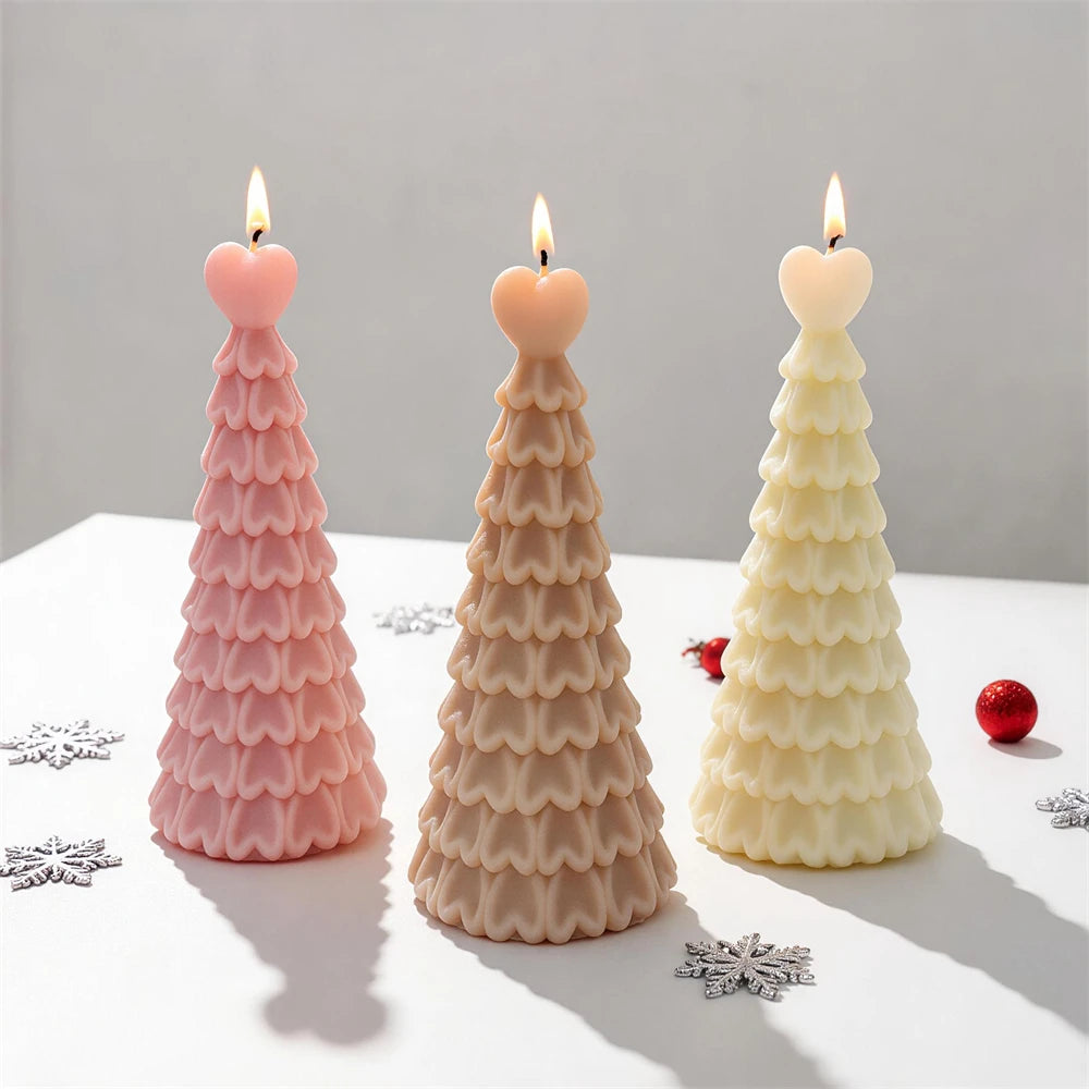 Pastel heart-topped Christmas tree candles displayed with festive ornaments