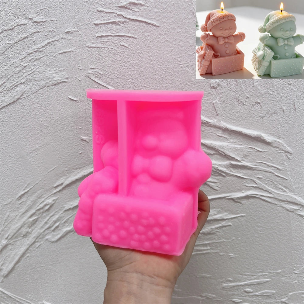 Pink silicone mold for creating a gingerbread gift box candle