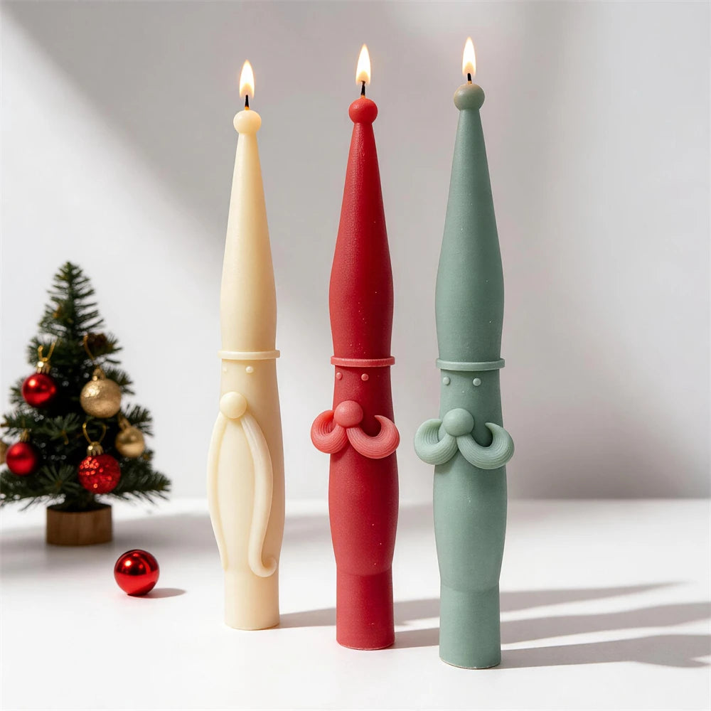 Tall Scandinavian Santa pillar candles in cream, red and green