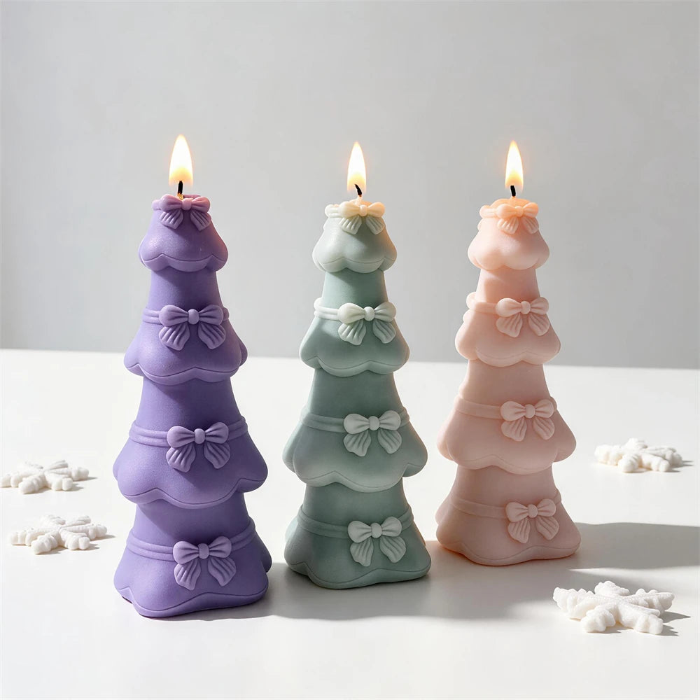 Tiered bow Christmas tree candles in pastel purple, green and pink