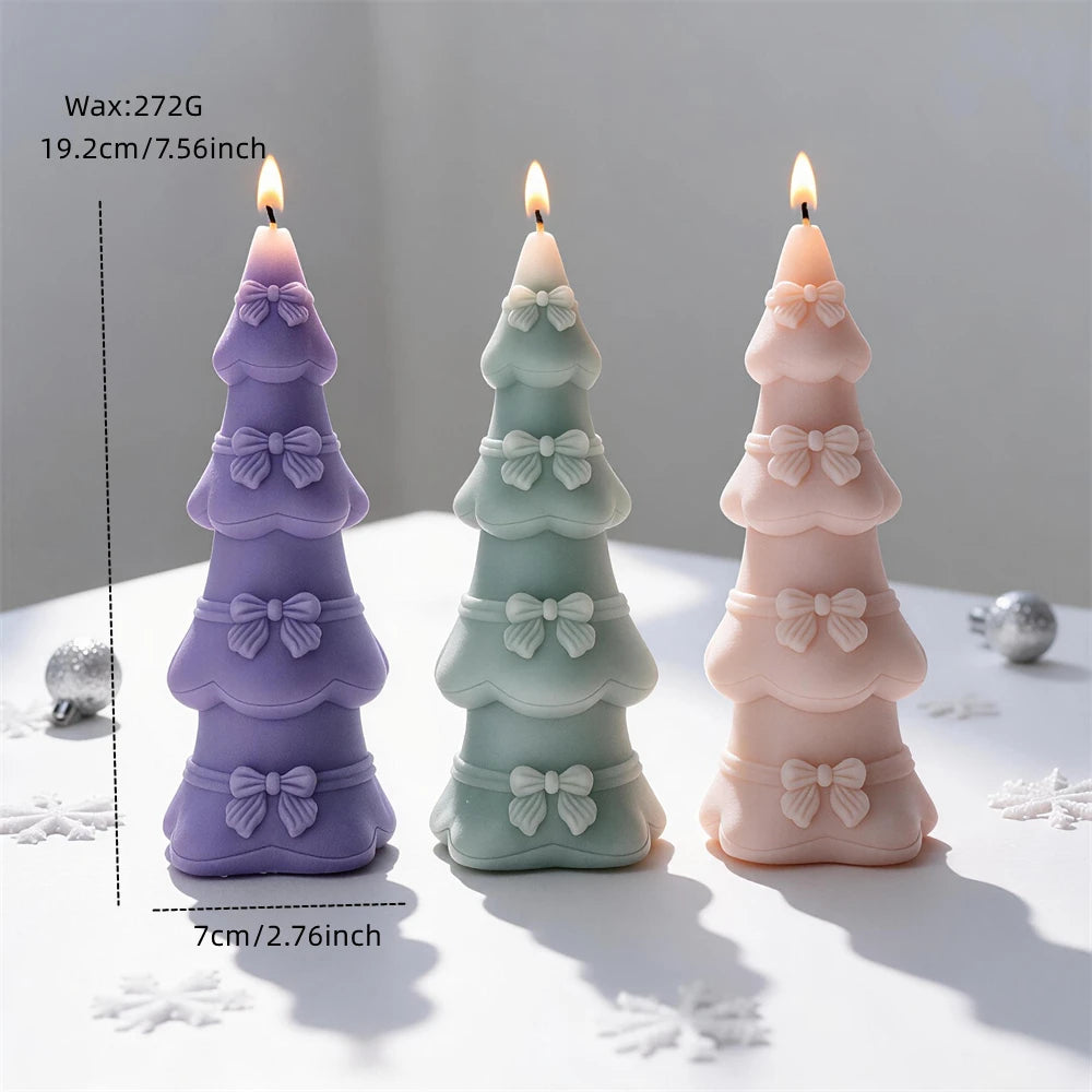 Tiered bow Christmas tree candle measuring 19.2 centimetres tall