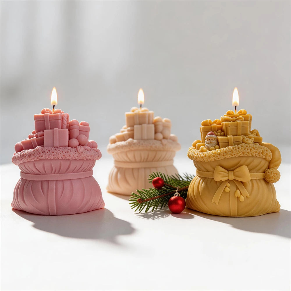 Festive gift sack candles in cream, pink and gold wax