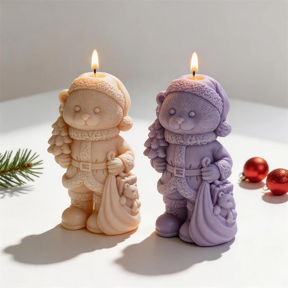 Christmas bear candles carrying a small tree and gift sack
