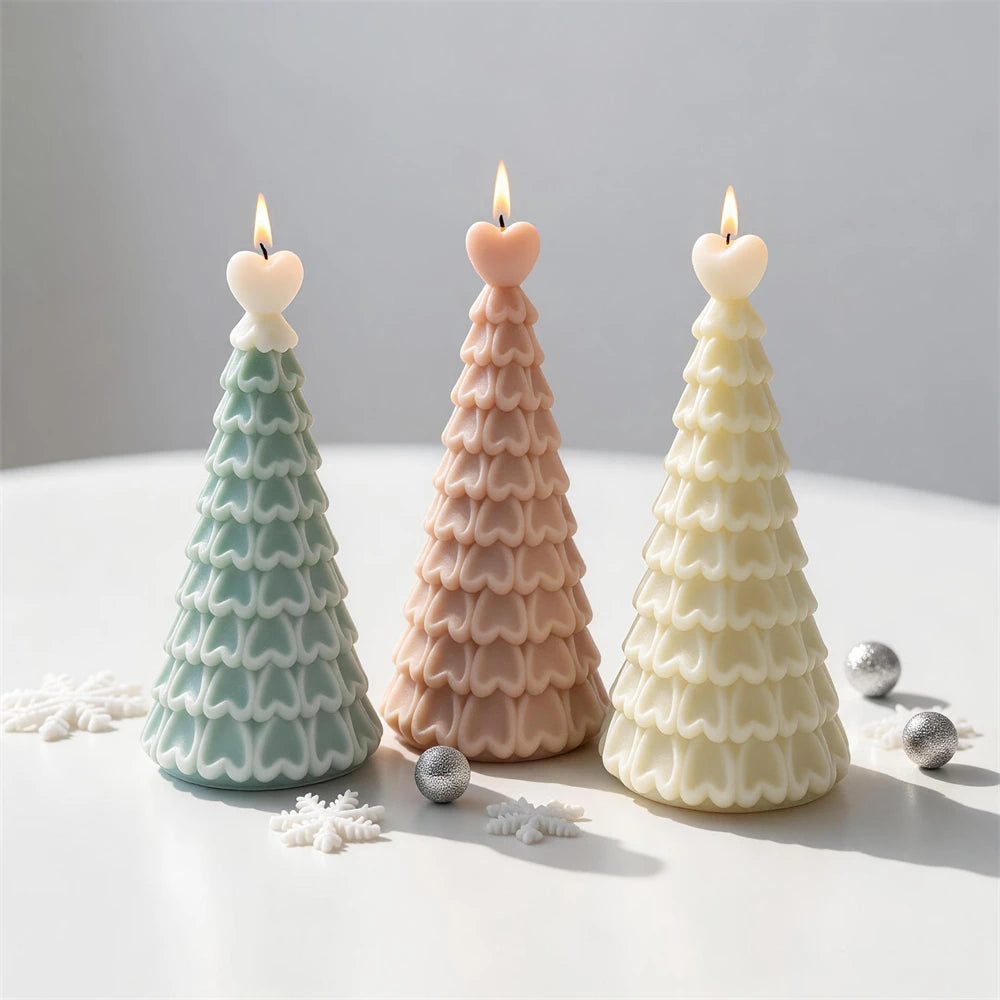 Heart-topped Christmas tree candles in green, beige and ivory wax