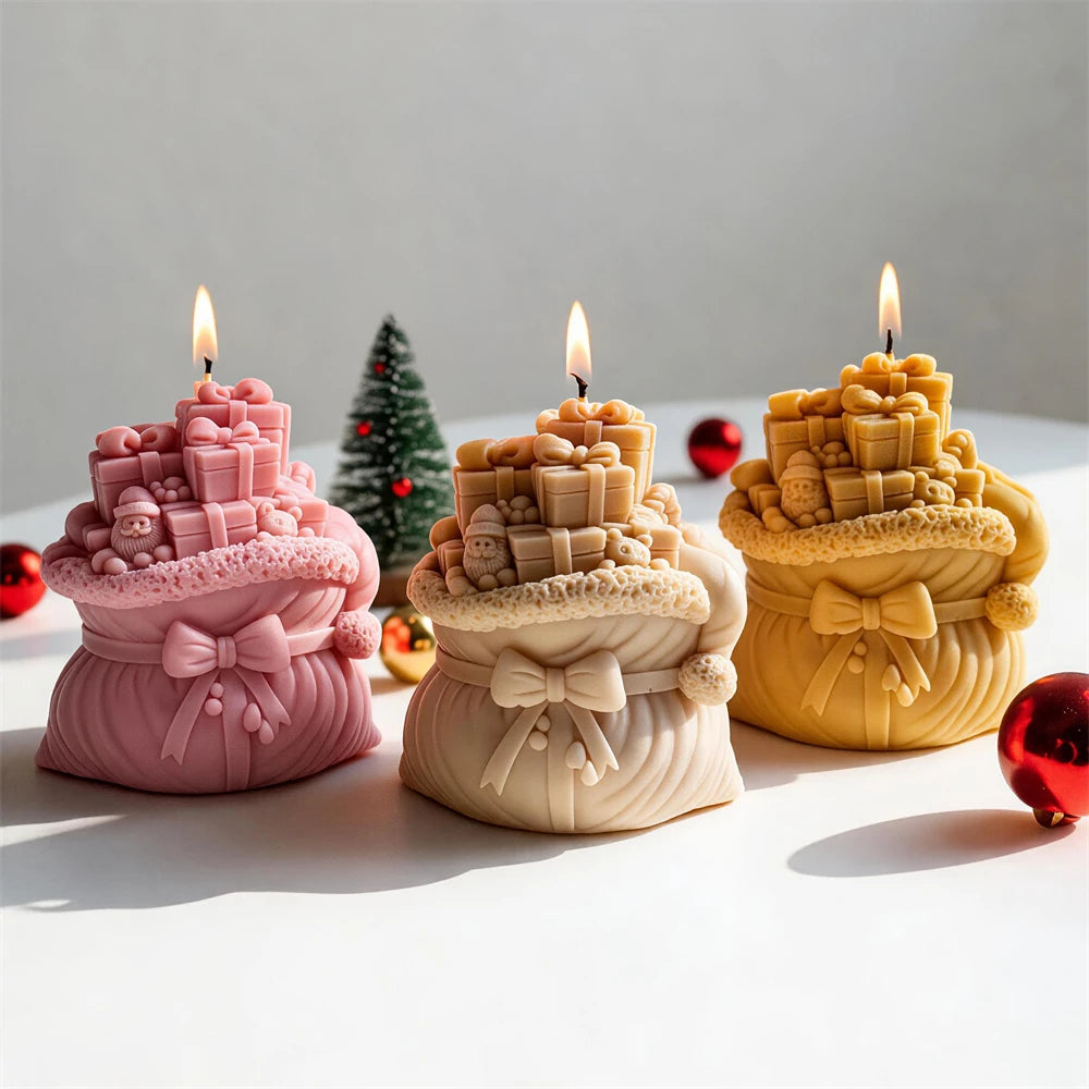 Festive gift sack candles in cream, pink and gold wax