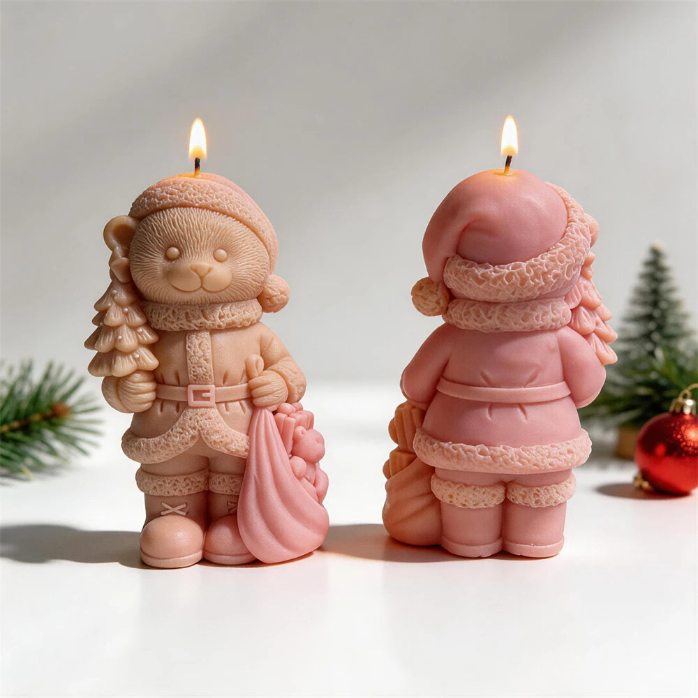 Teddy bear candle wearing a knitted hat, scarf and winter coat